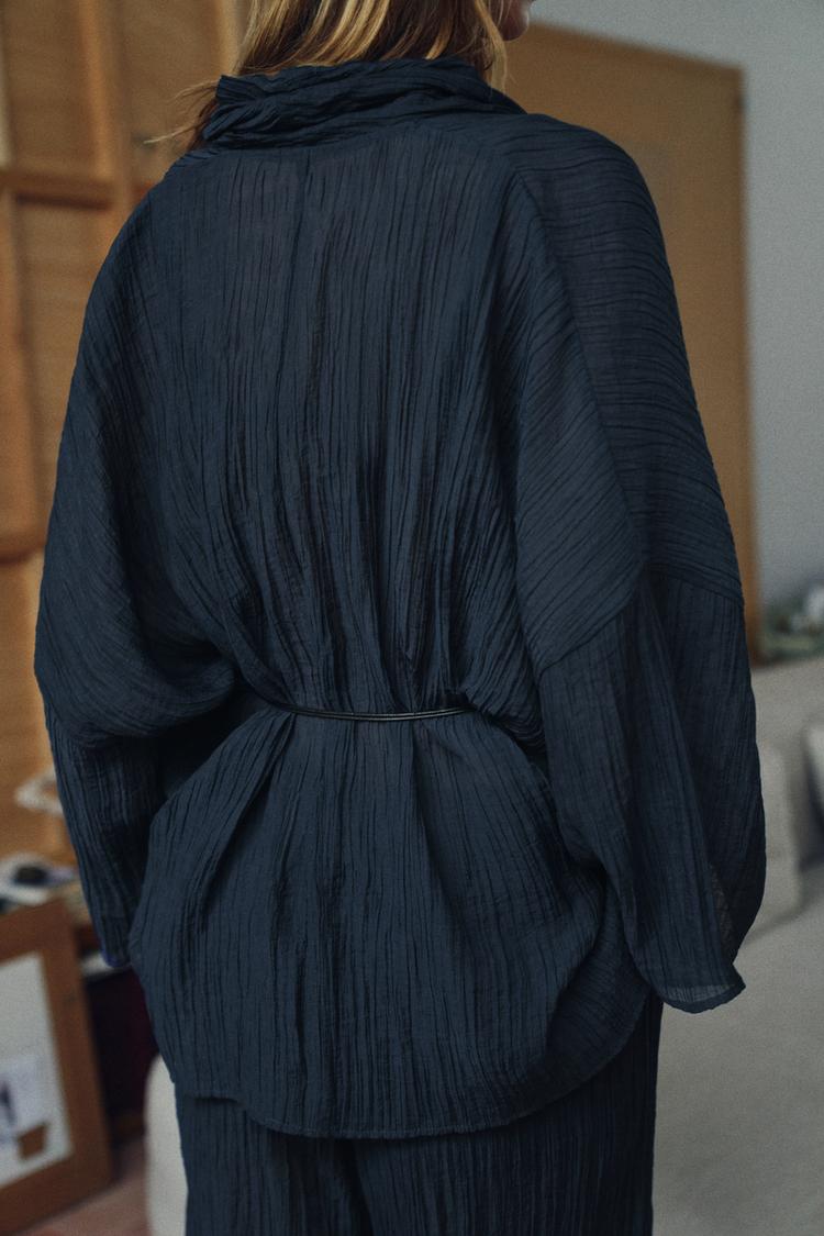 Close-up of V-neck linen top from Olive Muse two-piece co-ord set