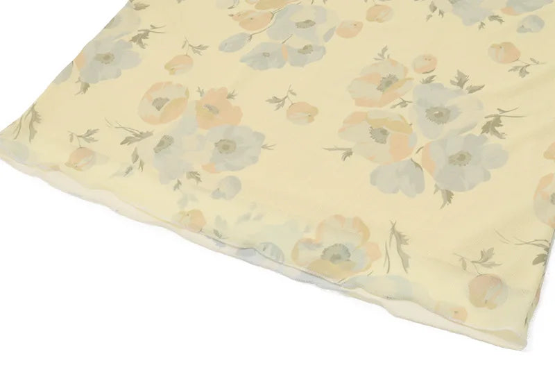 Detail of ruffle trim on Olive Muse yellow floral summer dress