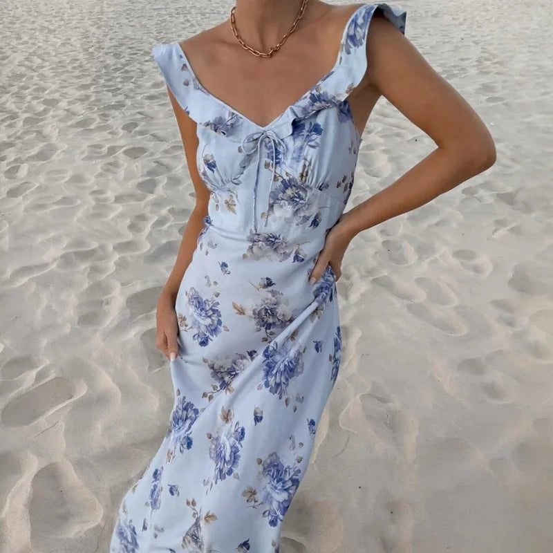Close-up of plunge neckline on Olive Muse blue floral maxi dress