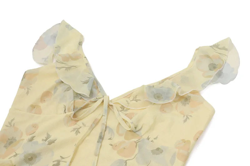 Woman modeling Olive Muse yellow floral ruffle maxi dress, side view