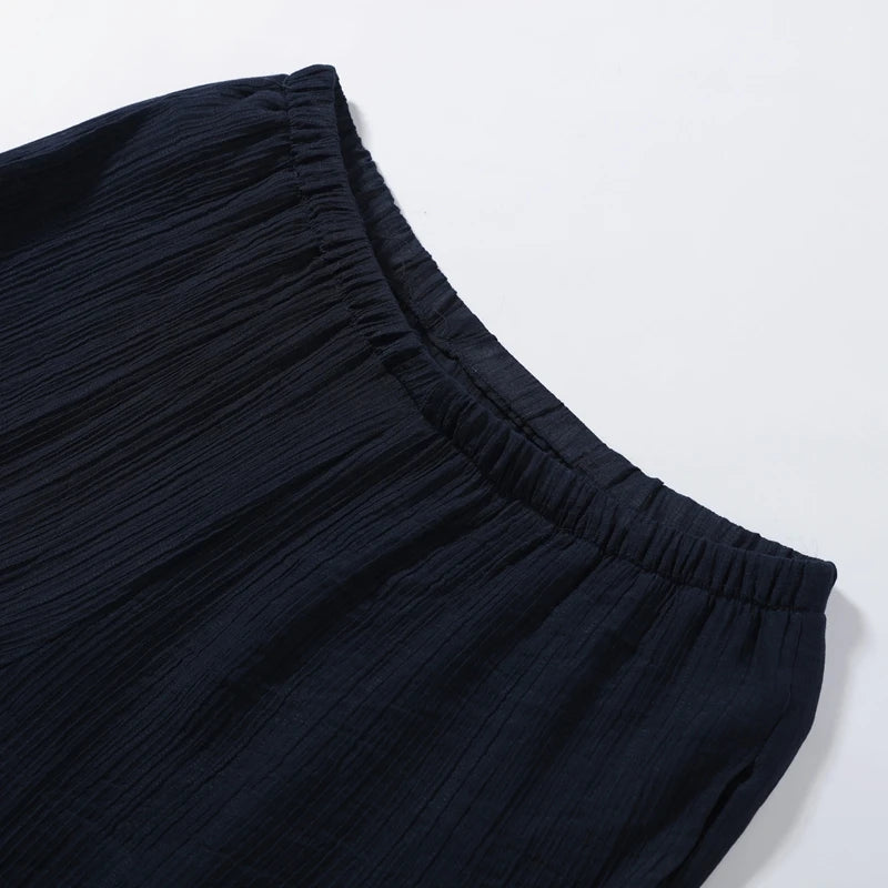 Woman modeling Olive Muse two-piece linen co-ord, back view